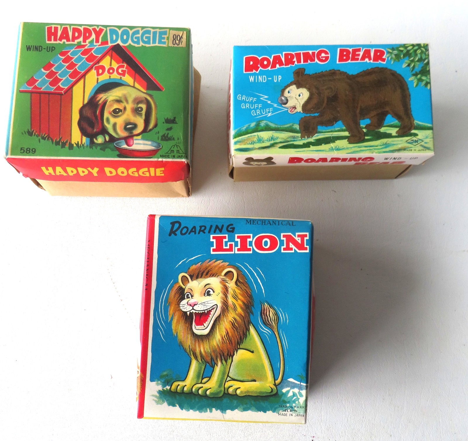 Grouping of 3 Japanese windup toys in original boxes. Includes: A walking "Roaring Bear"; a seated (1 of 12)