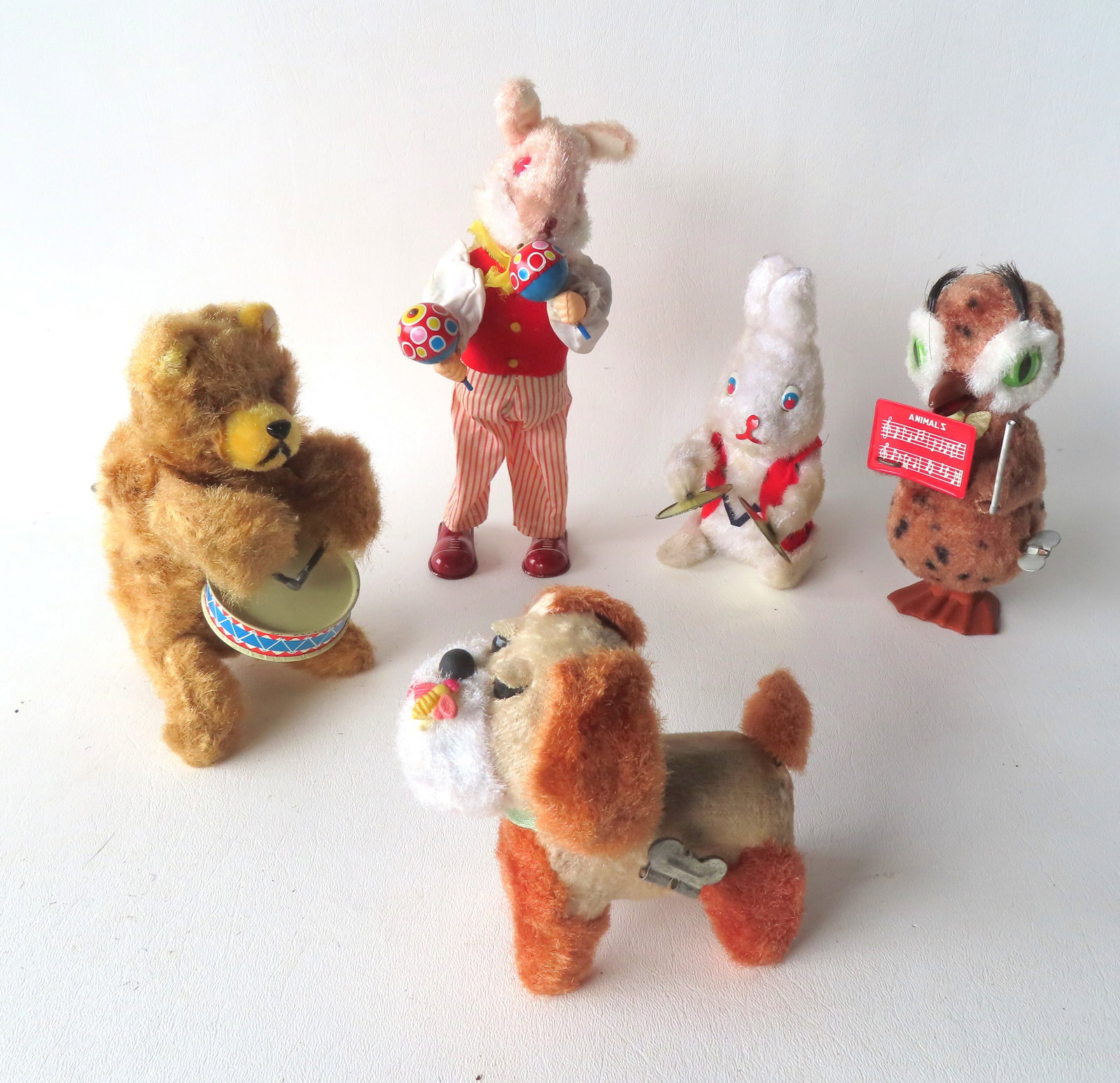 Four Japanese articulated windup toys including band of 4 toys musical related, including a bear (1 of 9)