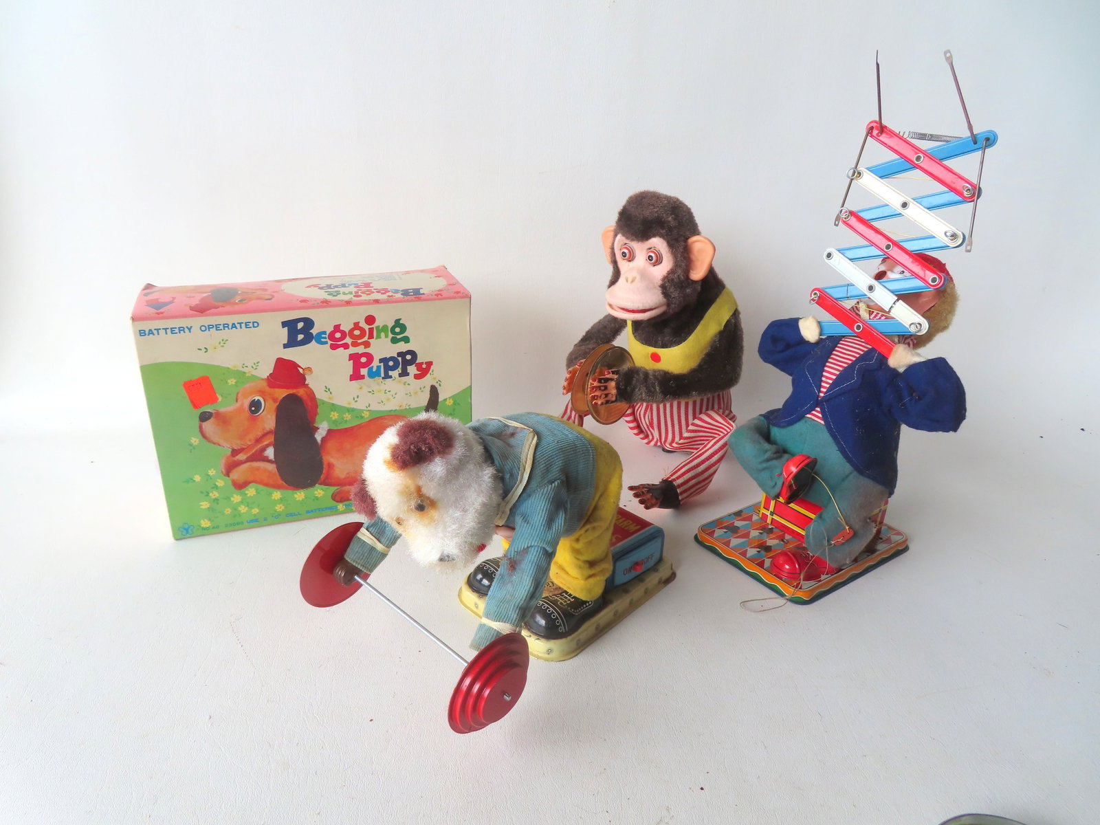 Four battery operated toys including: Cragston weight lifting bear "Powerarm Barbells" - contacts (1 of 14)