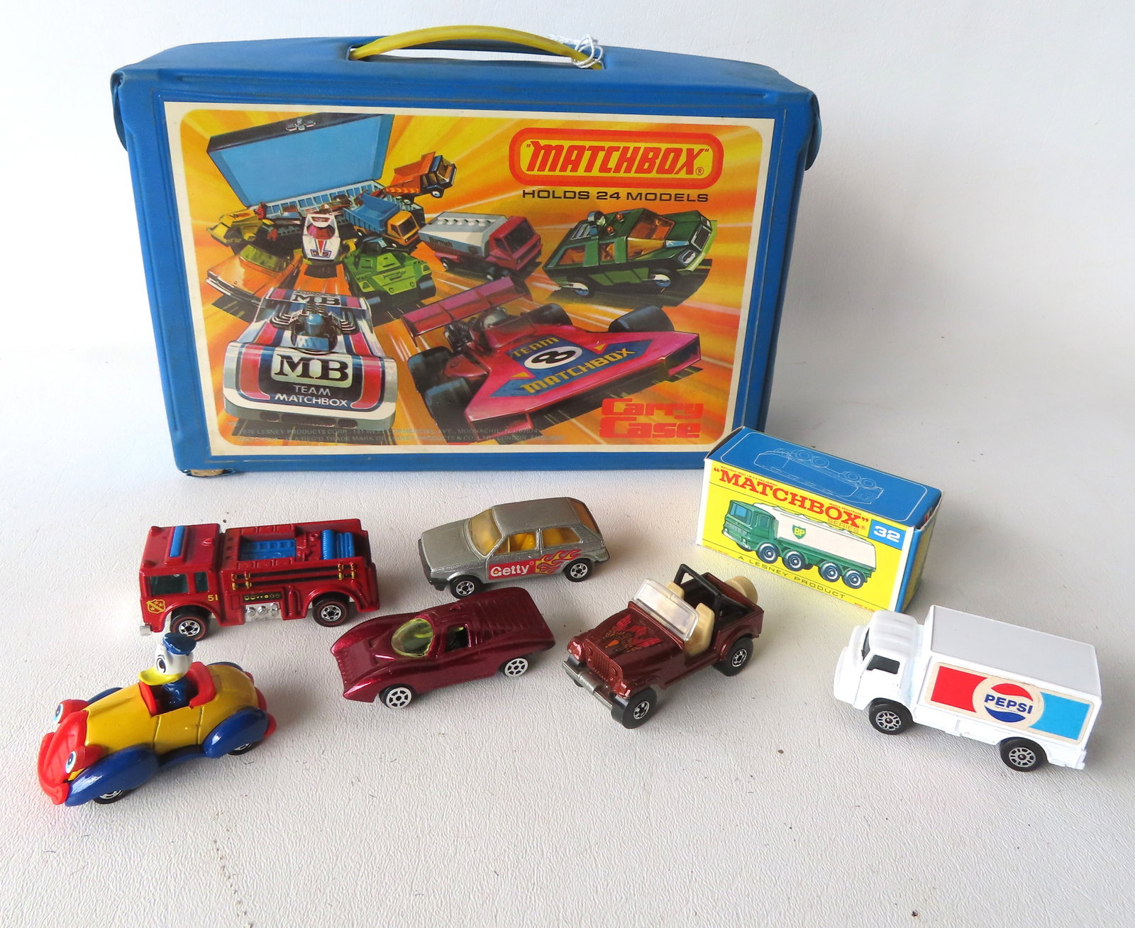 Collection of 22 Lesney Matchbox vehicles, 1971 to 1978, including original vinyl Matchbox case that (1 of 4)