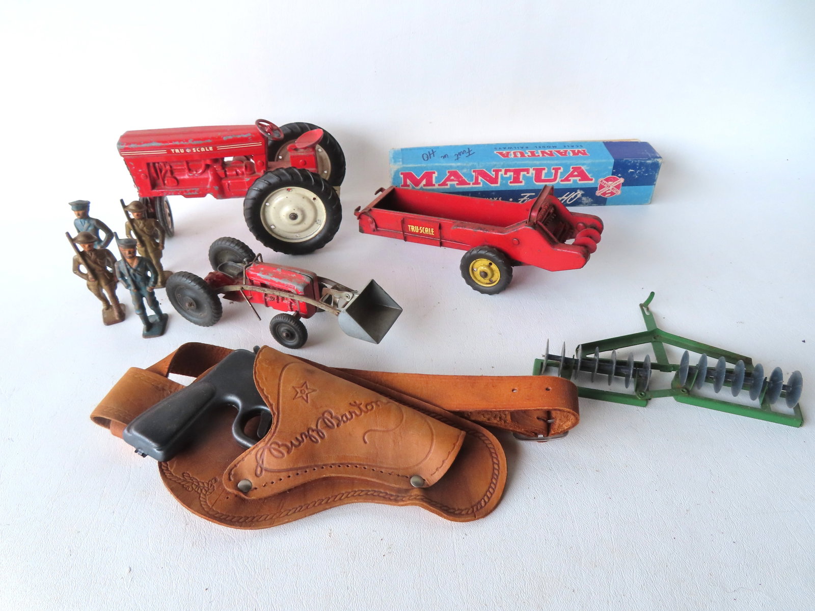 A grouping of vintage toys including: Four WWI painted lead soldiers, not signed - each (1 of 6)