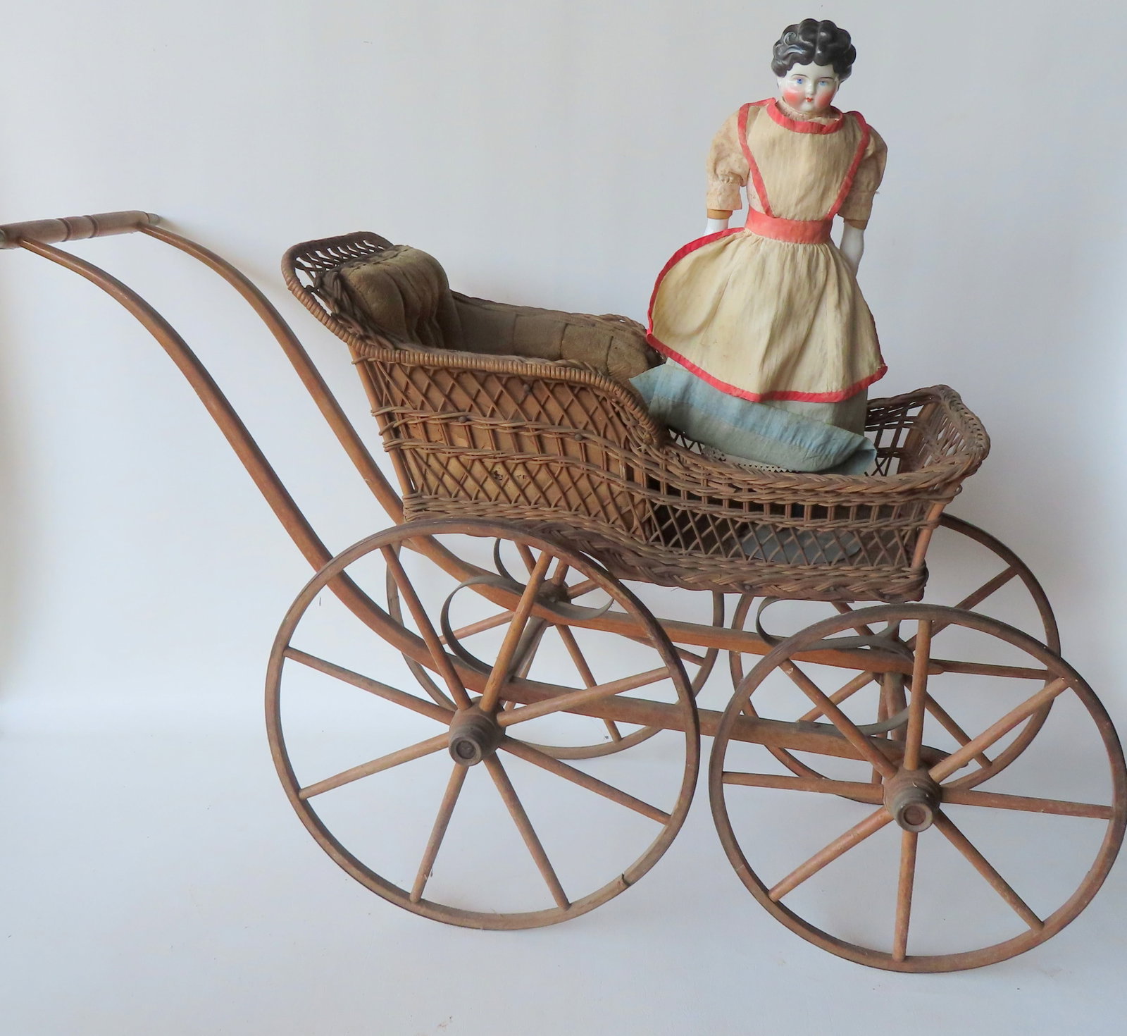 Vintage wicker doll stroller and a Victorian doll. Both late 19th century and in good condition. (1 of 11)