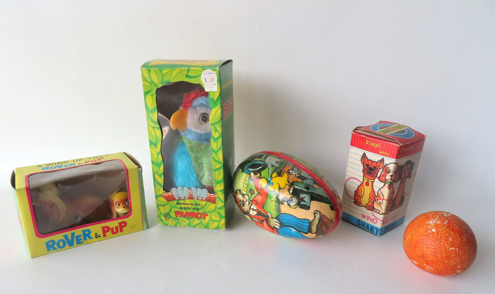 Grouping of 4 vintage toys including: A "Shaky Pups" windup vinyl Dachsund dog with ball, original: Grouping of 4 vintage toys including: A "Shaky Pups" windup vinyl Dachsund dog with ball, original box, in very good condition in working order by Alps Japan; a "Rover & Pup" Cocker Spaniel plastic wi