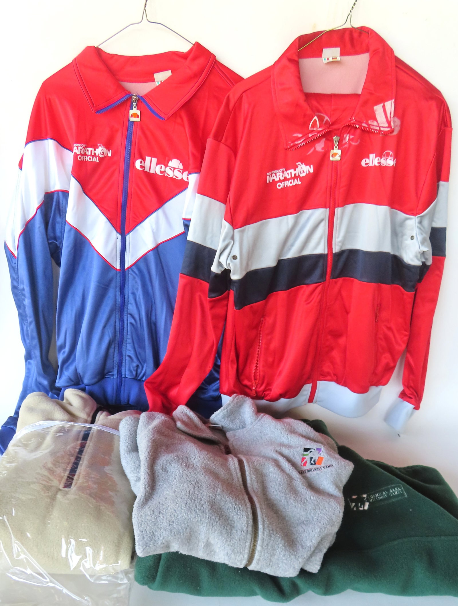 Grouping of NY City sporting related garments including: 3 Millrose Games adverting fleese sweat (1 of 17)