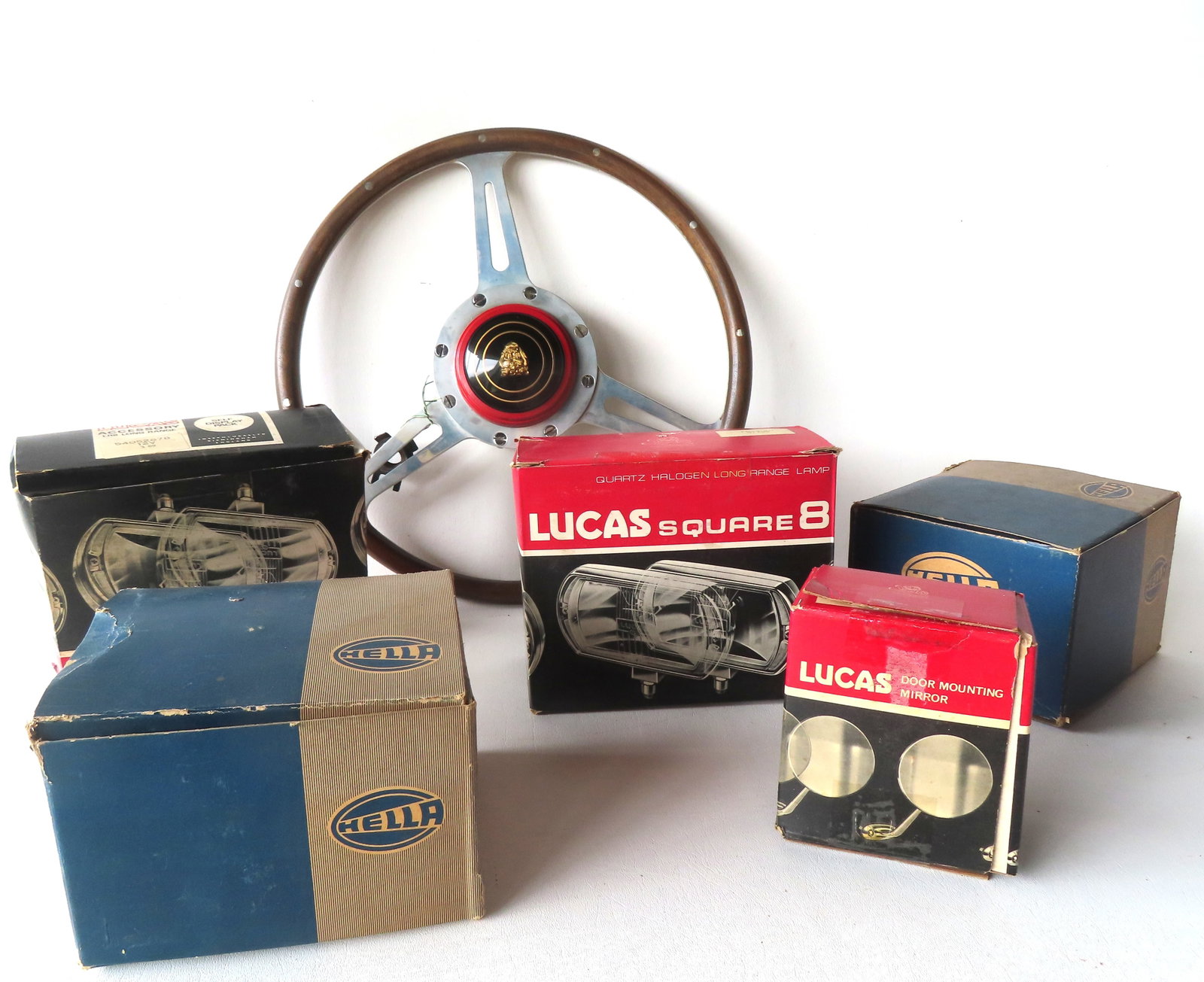 Grouping of vintage like new Jaguar auto accessories, all in boxes that appear to be original, circa: Grouping of vintage like new Jaguar auto accessories, all in boxes that appear to be original, circa 1961. The first, a steering wheel, which is the largest measuring 16" diameter x 2 3/4"D - excellen