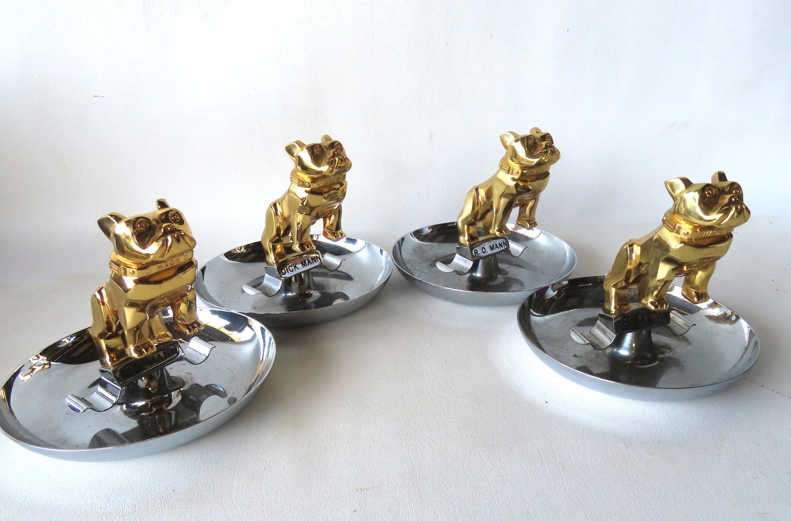 Grouping of 4 presentation Mack Truck bull dog ash trays. (1 of 5)