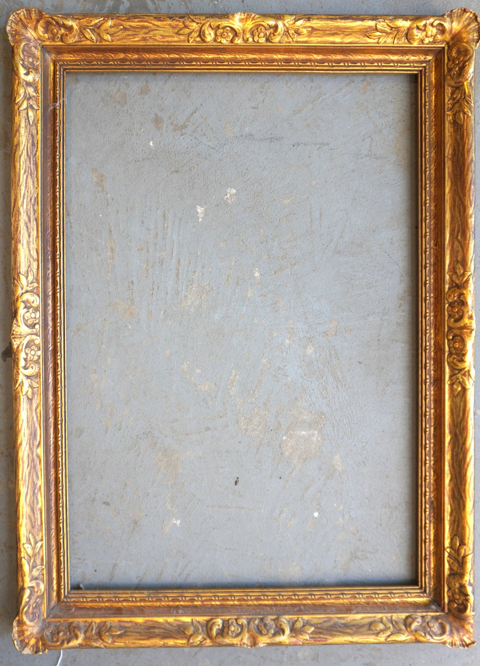A fancy carved gilded picture frame, in very good condition, circa 1930-50. Opening 22 1/8" x 32 1/4: A fancy carved gilded picture frame, in very good condition, circa 1930-50. Opening 22 1/8" x 32 1/4" and total frame size 27 3/4" x 38".