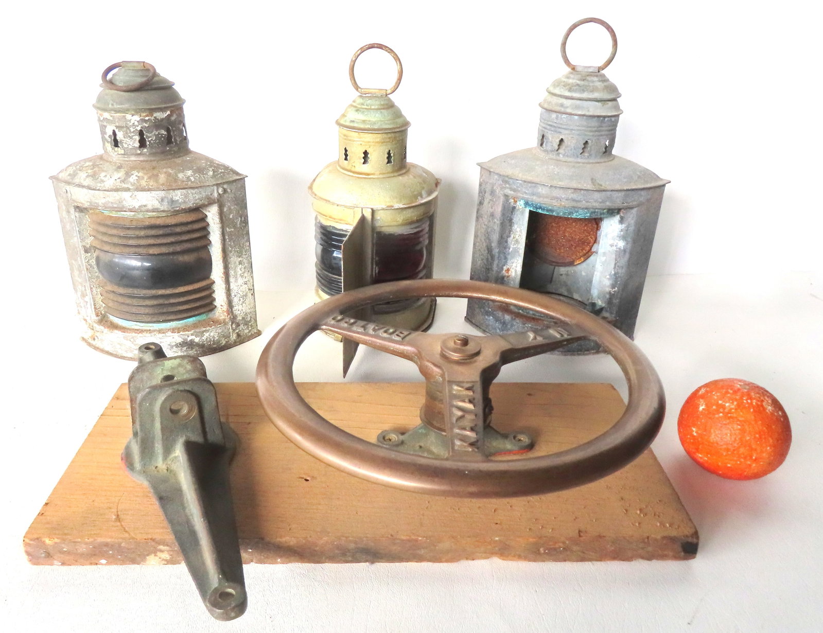 Collection of nautical items including a brass ship's wheel signed "Kayak Boat Co." NY, active 1930- (1 of 7)