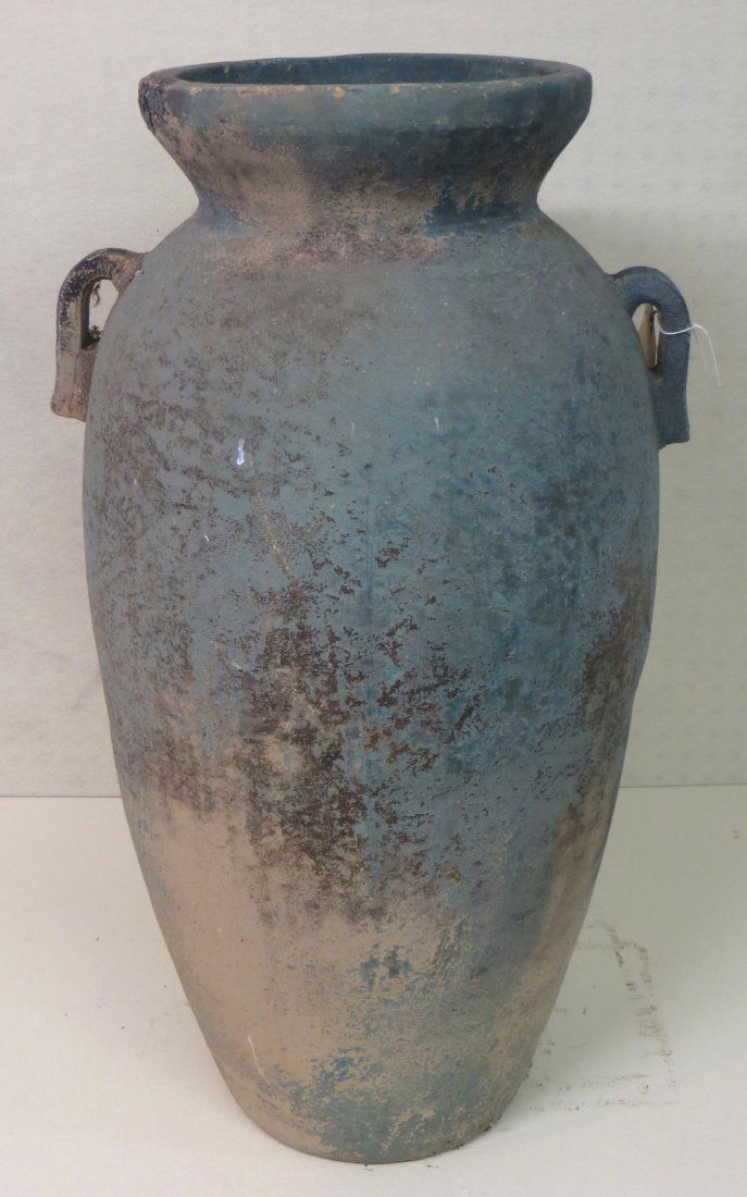 Large earthenware double handle urn/planter in old gree: Large earthenware double handle urn/planter in old green paint with drain hole in base. 29.25"H