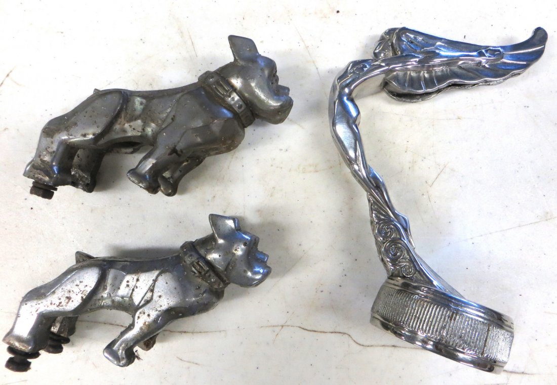 Two Mack Truck bull dog hood ornaments and a chrome Art: Two Mack Truck bull dog hood ornaments and a chrome Art Deco goddess radiator cap.