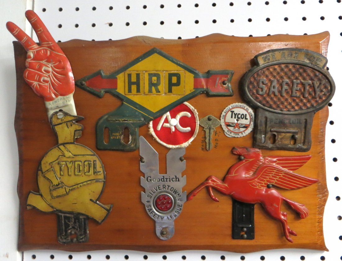 Collection of 6 vintage license plates toppers includin: Collection of 6 vintage license plates toppers including Tydol, Kendall, Pennzoil, Mobil, Goodrich, Sunoco. Mounted on a pine board with a Model T key.