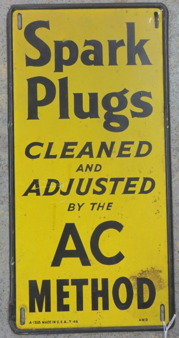 Sheet metal sign "Spark Plugs Cleaned And Adjusted" in : Sheet metal sign "Spark Plugs Cleaned And Adjusted" in original black and yellow paint - 8.75" x 17.75".