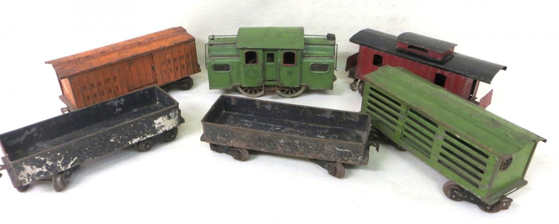 Set of Lionel Standard gauge trains including green eng: Set of Lionel Standard gauge trains including green engine 38 (original paint with some rust spots), 2 112 coal cars, orange box car 114, green livestock car, and red caboose 117.