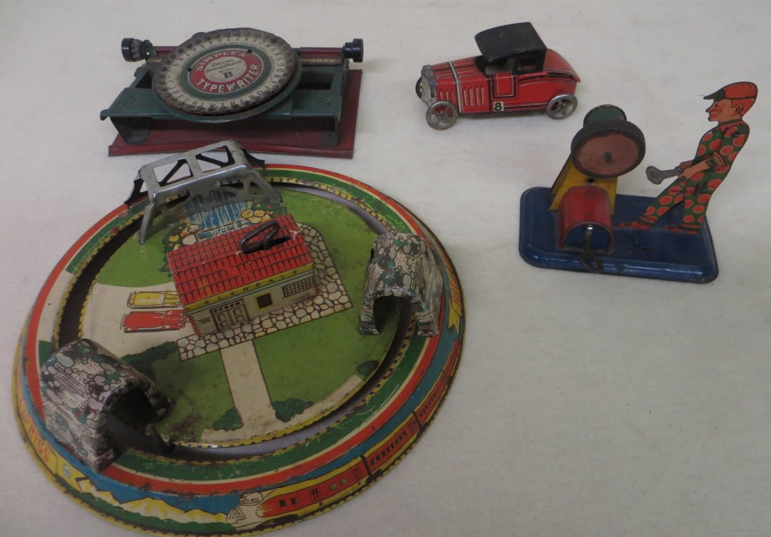 Lot of 4 tin toys including Simplex typewriter, Honeymo: Lot of 4 tin toys including Simplex typewriter, Honeymoon Express (missing cars), no. 8 tin race car, and a lithographed tin workman at grinding wheel windup toy (does not work).
