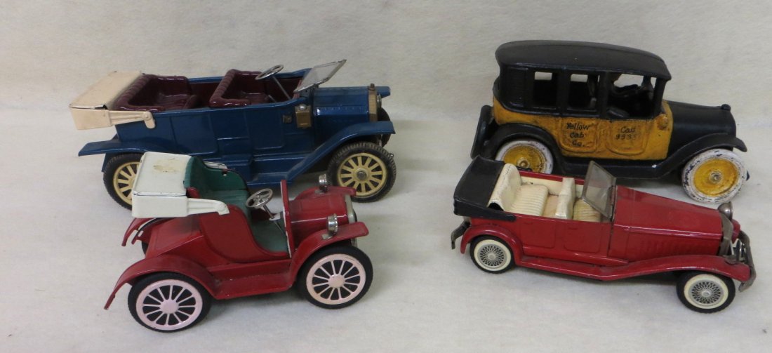 Collection of 4 cars including 2 friction cars, 1 crank: Collection of 4 cars including 2 friction cars, 1 crank windup, and a cast iron yellow cab (unknown vintage).