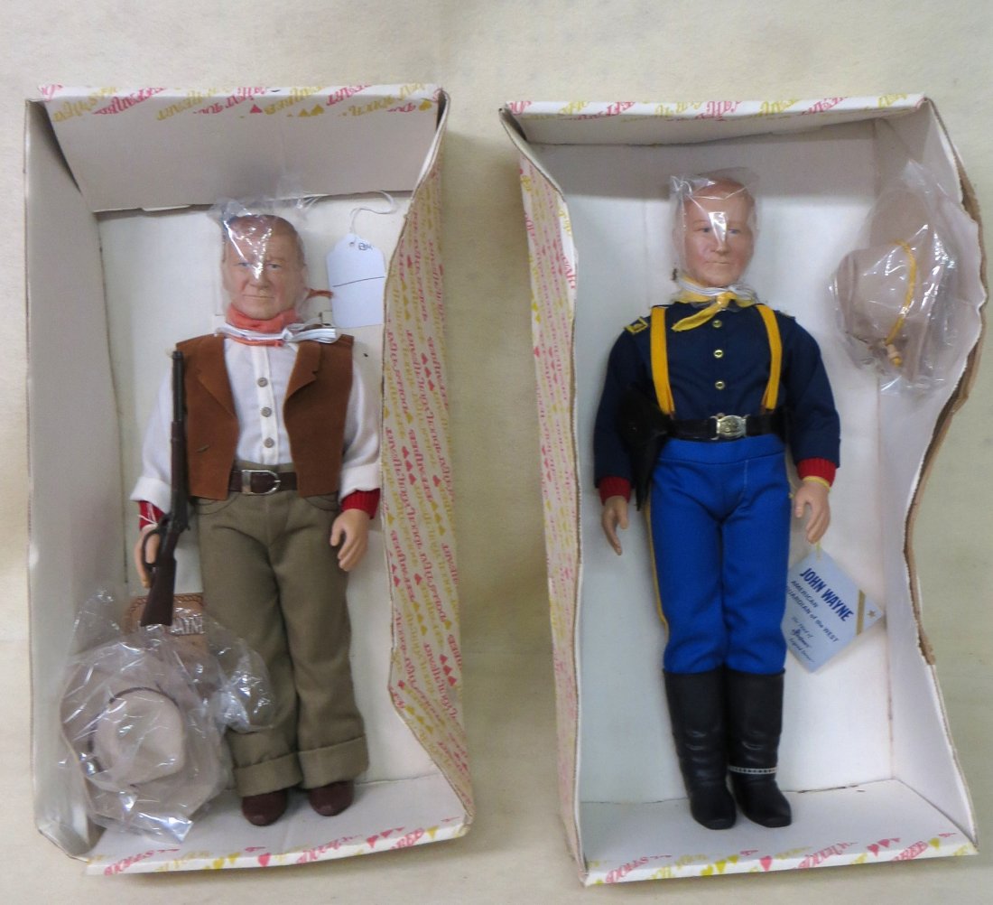 Two John Wayne dolls in original boxes by Effanbee. (bo: Two John Wayne dolls in original boxes by Effanbee. (boxes with some crushing).