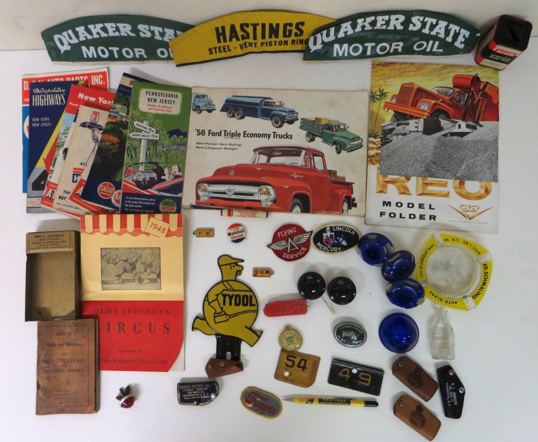Lot of Automobile memorabilia.: Lot of auto related memorabilia including tin TYDOL license plate attachment, plastic Esso bank, assortment of old road maps, Mobiloil pin back, advertising key cases, 1948 Hunt Bros. Circus brochure 