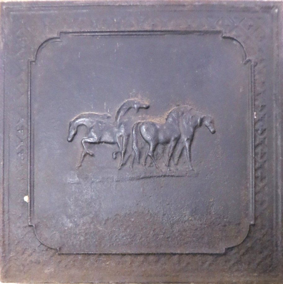 Fireback or stove plate with embossed horses on front -: Fireback or stove plate with embossed horses on front - probably late 18th or early 19th century - 19.75"square.