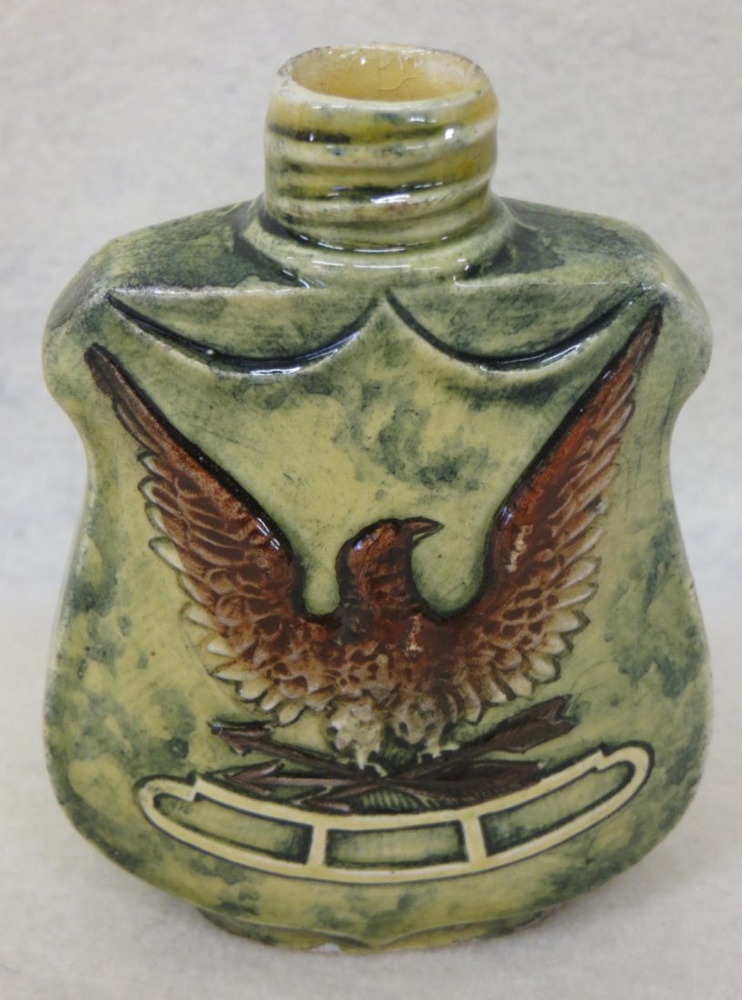 American patriotic majolica porcelain flask with emboss: American patriotic majolica porcelain flask with embossed spread wing eagle with talons holding arrows within a shield, marked 11043 on base - 3.5"H. Probably Civil War era.