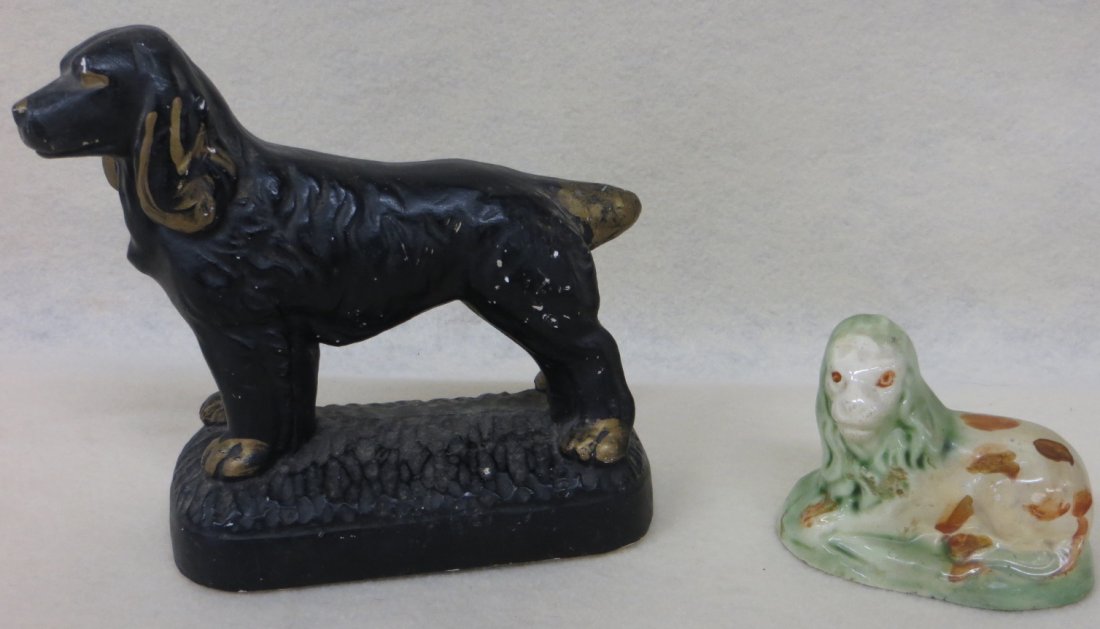 Two small country items including chalkware seated span: Two small country items including chalkware seated spaniel 6"H and a small hollow earthenware resting lion with light green mane and brown splotch sponge decorations 2.75"L x 3.5"H.