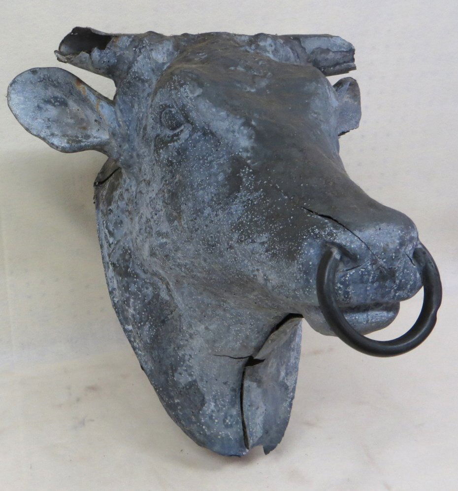 Outstanding zinc life size bull's head trade store sign: Outstanding zinc life size bull's head trade store sign - original metal nose ring - some losses to end of horns - original wooden back boards which are loose - some separation of seam at neck - some