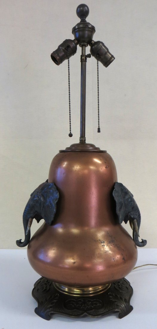 Brass table lamp signed Bradley & Hubbard on base -: Brass table lamp signed Bradley & Hubbard on base - applied painted metal elephant handles on sides in what appears to be original paint. Iron base decorated with embossed spread wing bats - 15"H to t