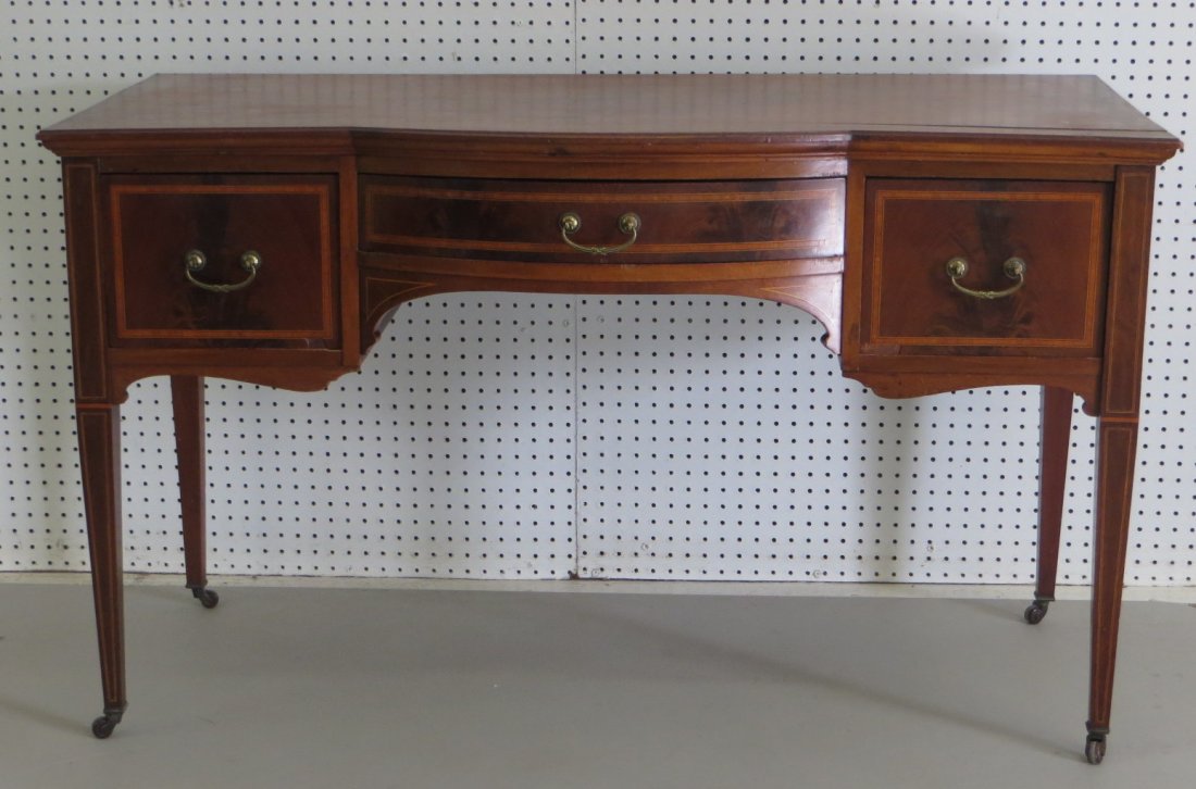 Centennial Hepplewhite style mahogany desk with inlay -: Centennial Hepplewhite style mahogany desk with inlay - casters at end of tapered legs - 1 center drawer flanked by 2 side drawers - shaped front - all bench made - 30.25"H x 51.25"L x 25.25"D