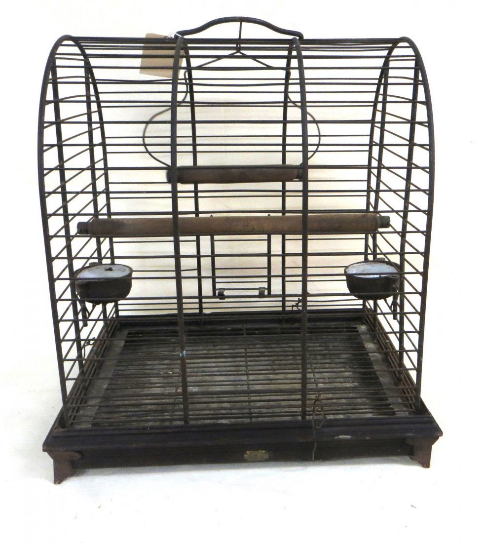 Victorian brass & iron bird cage with cast iron: Victorian brass & iron bird cage with cast iron enameled feeders - 20"L x 17"W x 22"H.