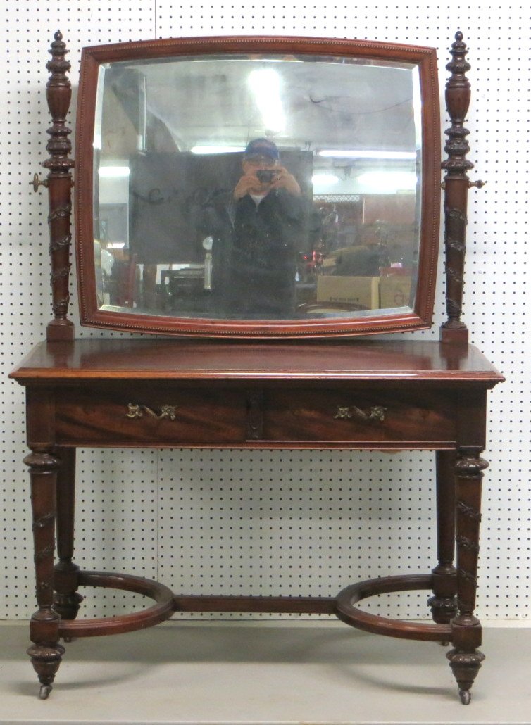 Outstanding Victorian dressing table with beveled glass: Outstanding Victorian dressing table with beveled glass mirror, 2 drawers, carved legs and cross stretchers.