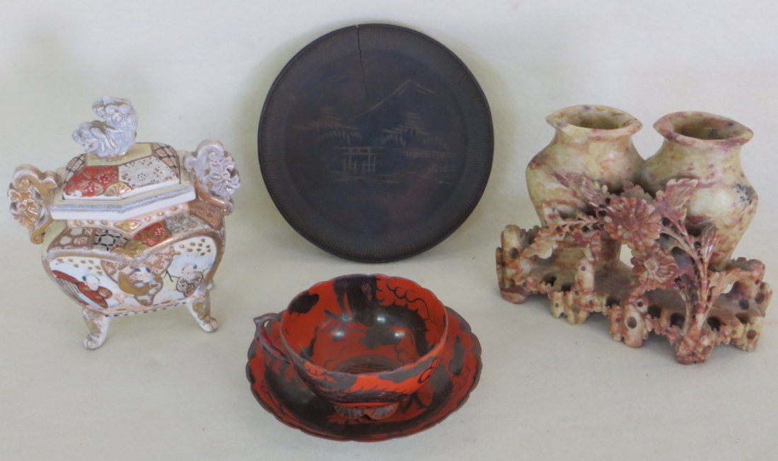 Five oriental objects including red tea cup and saucer: Five oriental objects including red tea cup and saucer with silver overlay and oriental signature on base; soapstone double base 5.5"H x 6.5"L (chip to rim), Satsuma creamer with repair to one leg, an