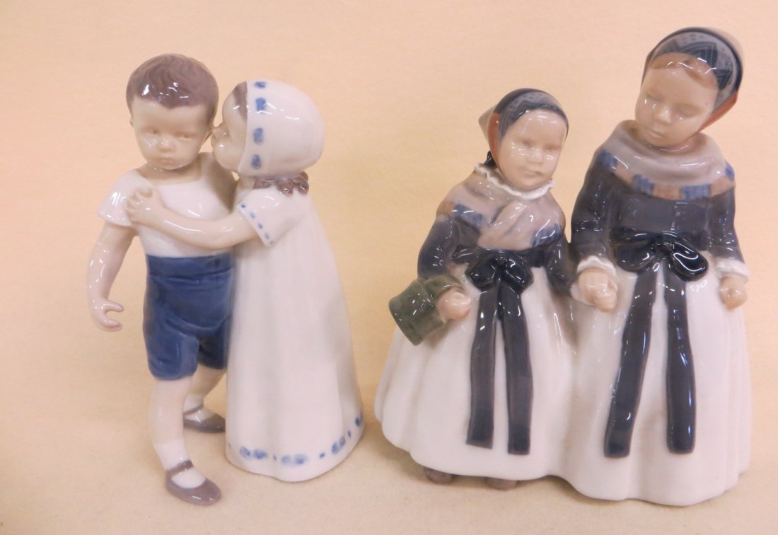 Two good figurines of children including girl kissing: Two good figurines of children including girl kissing boy signed B & G Denmark 6.75"H and 2 sisters holding hands signed Royal Copenhagen with Shreve, Crump & Low Co. sticker on base. 7.5"H. Both exce