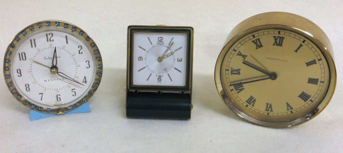 Three dresser clocks including Tiffany & Co. , Swiss: Three dresser clocks including Tiffany & Co. , Swiss made Jaeger, and Westclox Baby Ben decorated with rhinestones.