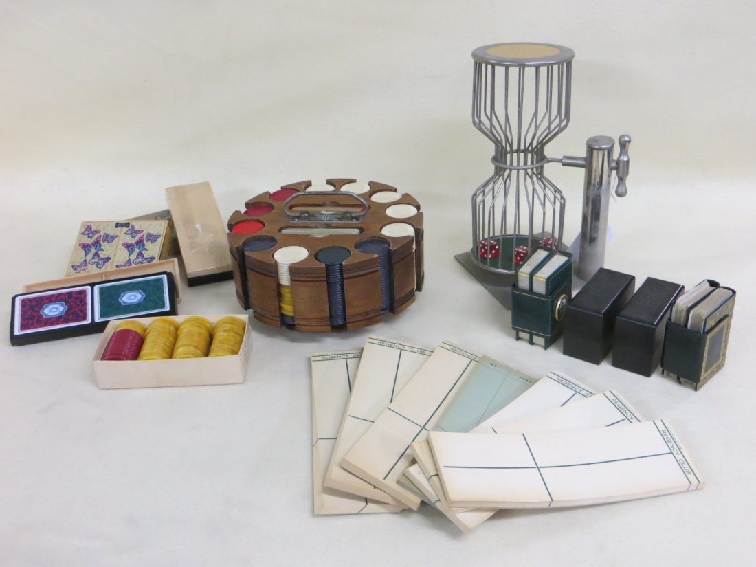 Collection of playing cards and gambling items: Collection of playing cards and gambling items including flip top dice game, set of mostly plastic poker chips in holder, set of Bakelite poker chips, 8 sets of boxed playing cards (most in excellent 