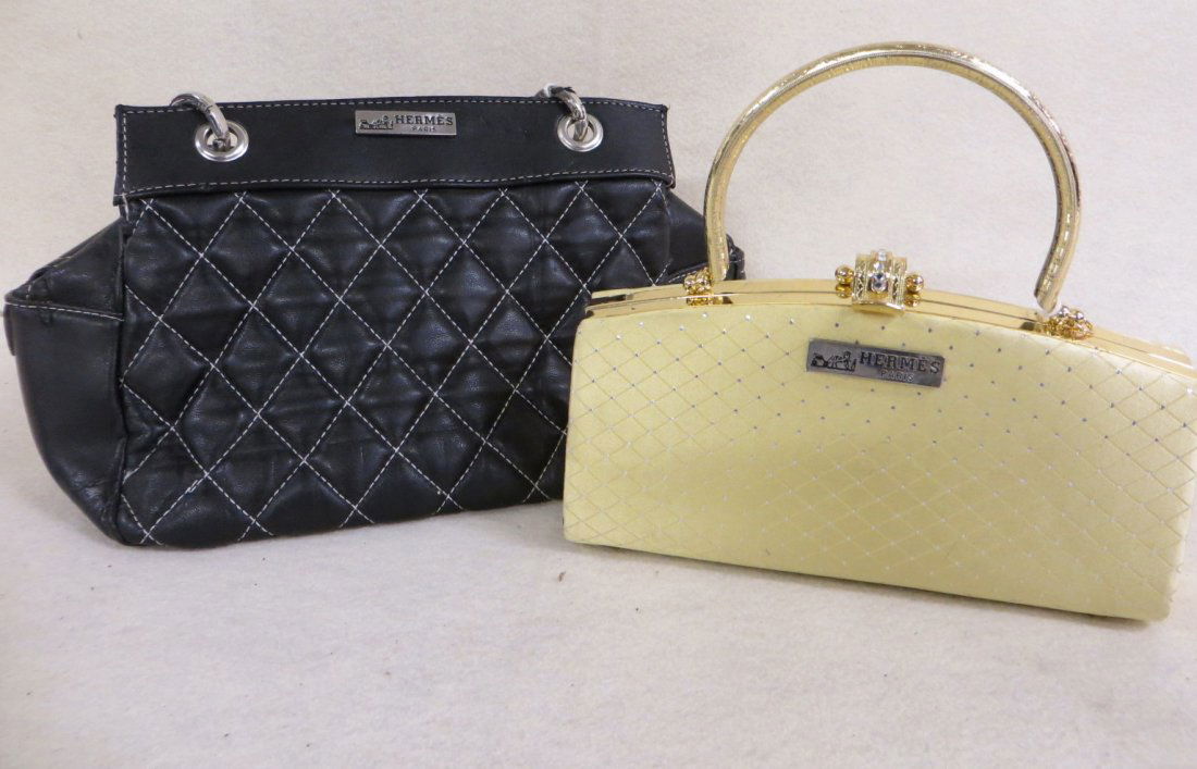 Two lady's hand bags labeled Hermes Paris. Please note: Two lady's hand bags labeled Hermes Paris. Please note none of the purses and hand bags in this sale have been authenticated and are being sold as is. Please call for further description. Provenance:
