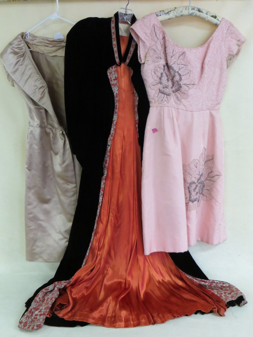 Three quality lady's garments including pink cocktail: Three quality lady's garments including pink cocktail dress decorated with beads and beads in floral design labeled Monet (some staining around arms), velvet robe with silk/satin lining labeled Sara F