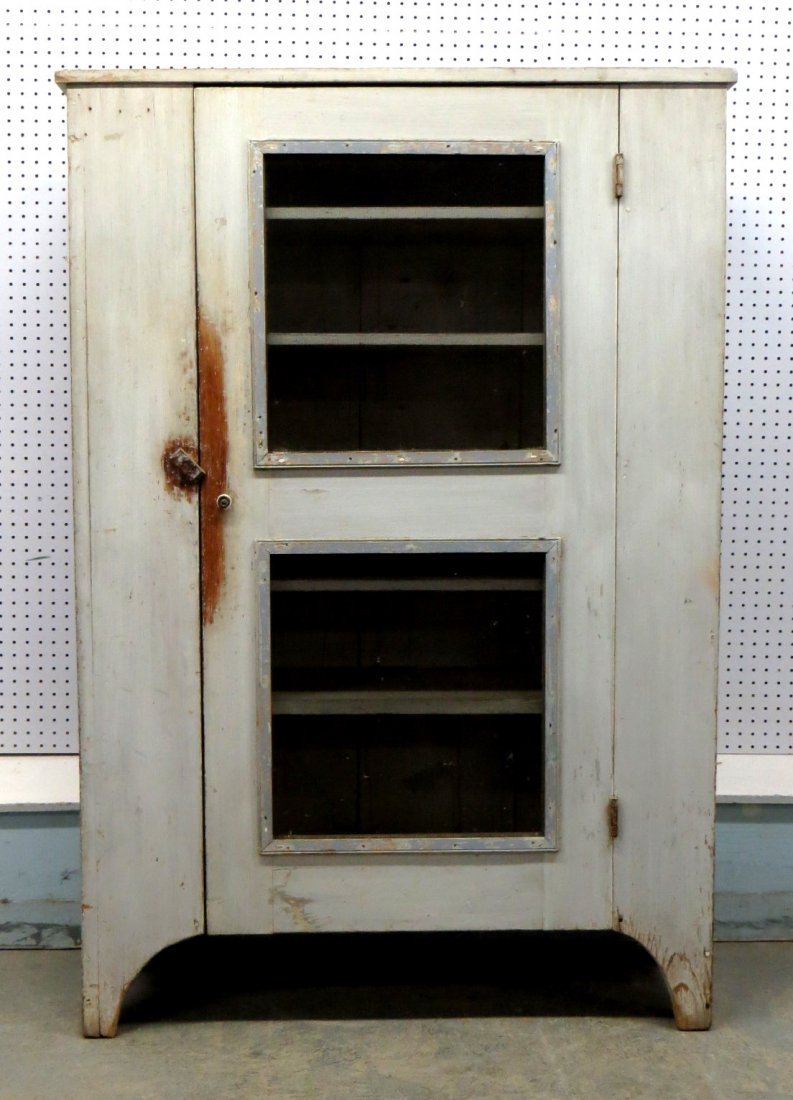 Early screen pie safe in old gray paint, on cutout base: Early screen pie safe in old gray paint, on cutout base with 1/2 moon sides - 6 shelves. Good overall condition. 61.25"H x 42"W x 15"D.