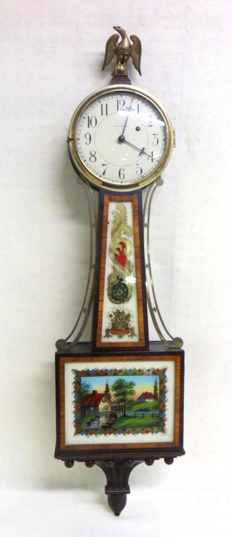 Signed Waltham banjo clock with reverse painting of: Signed Waltham banjo clock with reverse painting of mill, stream and house - brass eagle finial - 19th century. 41"H.