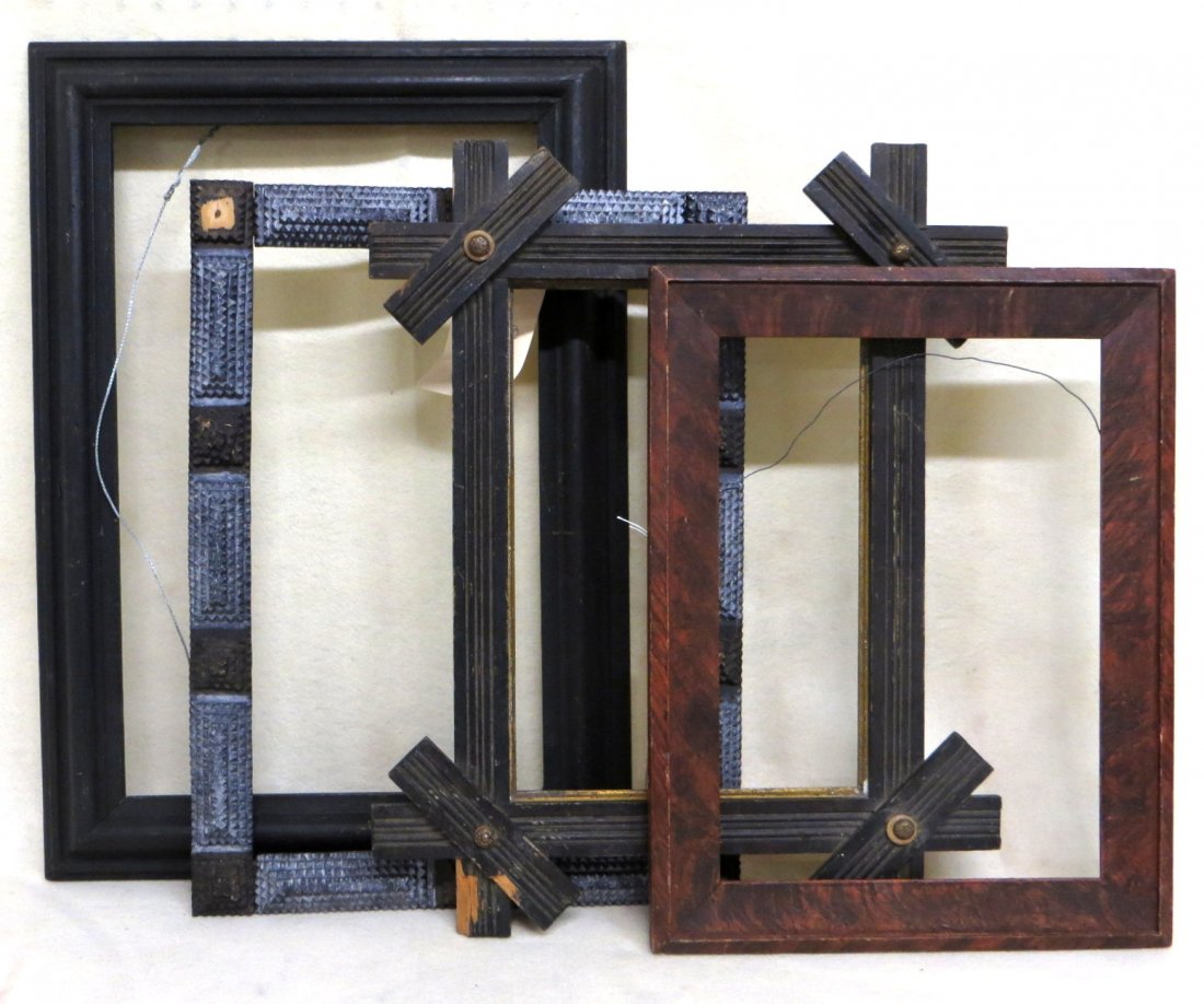 Four 19th century picture frames including grain: Four 19th century picture frames including grain painted, one in original black paint, tramp art frame with loss to 1 corner and a Victorian folk art frame.