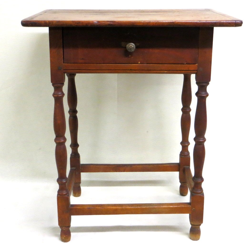 Early New England tap table with center drawer on: Early New England tap table with center drawer on turned legs and feet with original cross stretchers - one board top with bread board ends - beading on apron - possible drawer restoration - 23.5"W x 