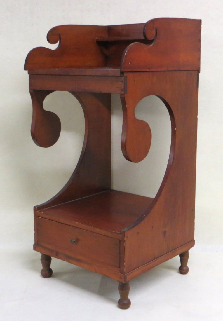 Sheraton poplar washstand with dovetailed backsplash,: Sheraton poplar washstand with dovetailed backsplash, lollipop cutouts under on sides over lower drawer on turned feet. Good overall condition. 36"H x 17"W x 16.75"D.