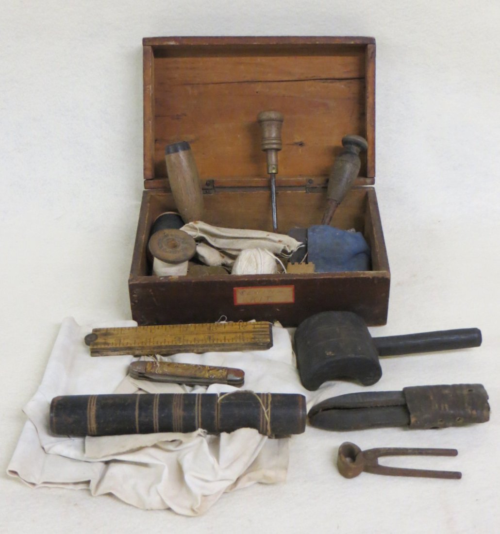 Sailor's sail repair kit with tools, rule, needle case: Sailor's sail repair kit with tools, rule, needle case and material in original box - 19th century - 9"L.