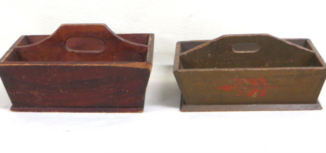 Two early painted cutlery boxes including one in: Two early painted cutlery boxes including one in original red/black grain paint and the other in original green paint with red decorations including flowers and stars.