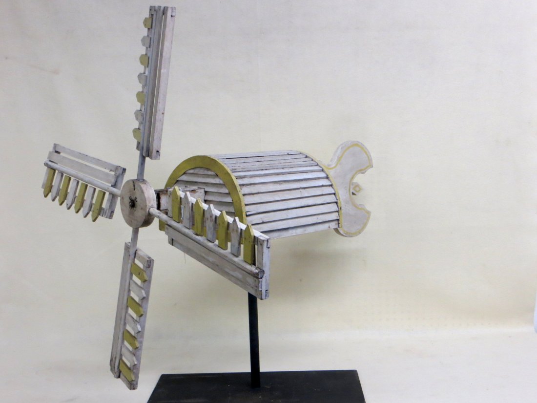 Whirligig in the form of a windmill - original yellow: Whirligig in the form of a windmill - original yellow and white paint - 36"L of whirligig and propeller length 37.5"H. Early to mid-19th century.