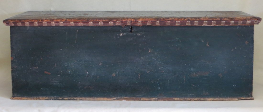 Large blanket box in original blue paint with rattail: Large blanket box in original blue paint with rattail hinges - molded edge top with original red and white decorations - wrought iron handles - some wear to blue paint otherwise in good condition. 54"
