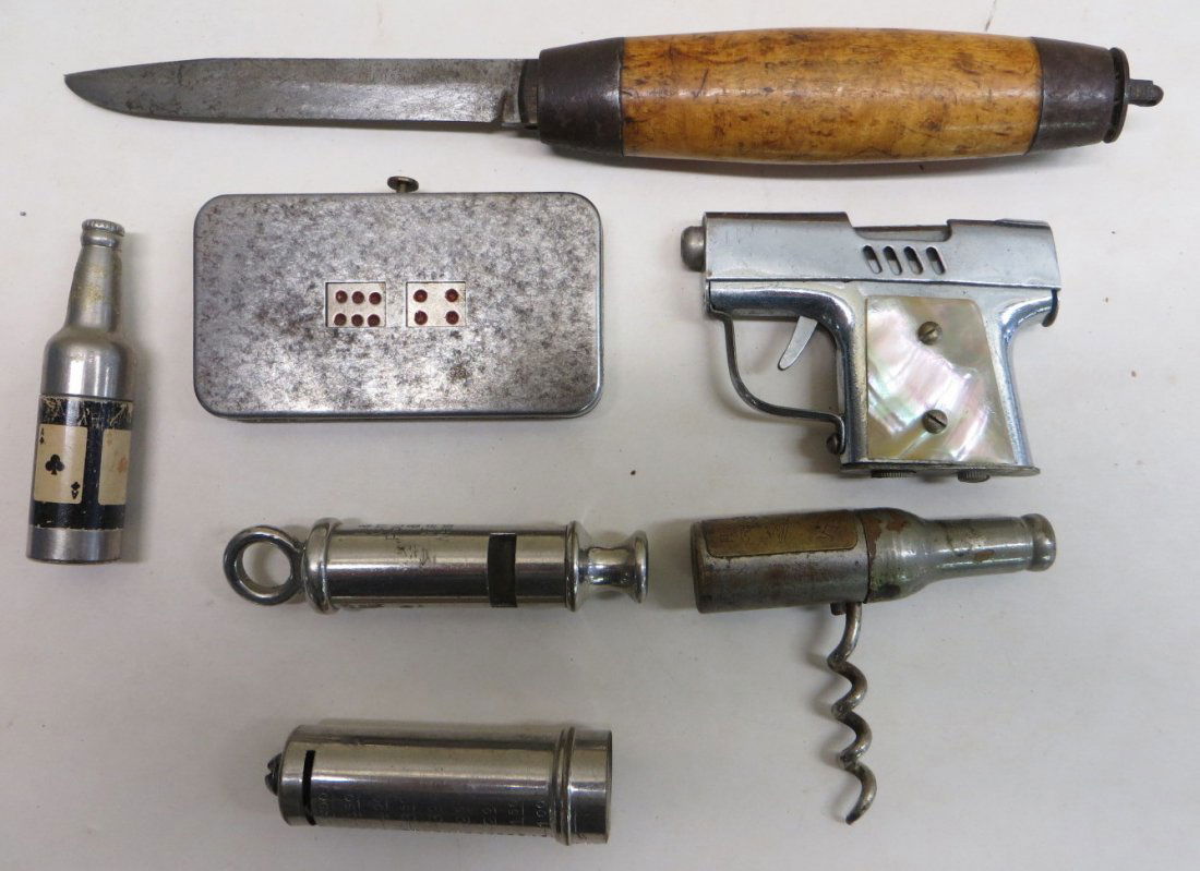 Lot of collectibles including pistol form cigarette: Lot of collectibles including pistol form cigarette lighter, mechanical dice game (non-working), Police and Fire whistle, bottle form cork screw signed Anheuser Busch, bottle form cigarette lighter, d