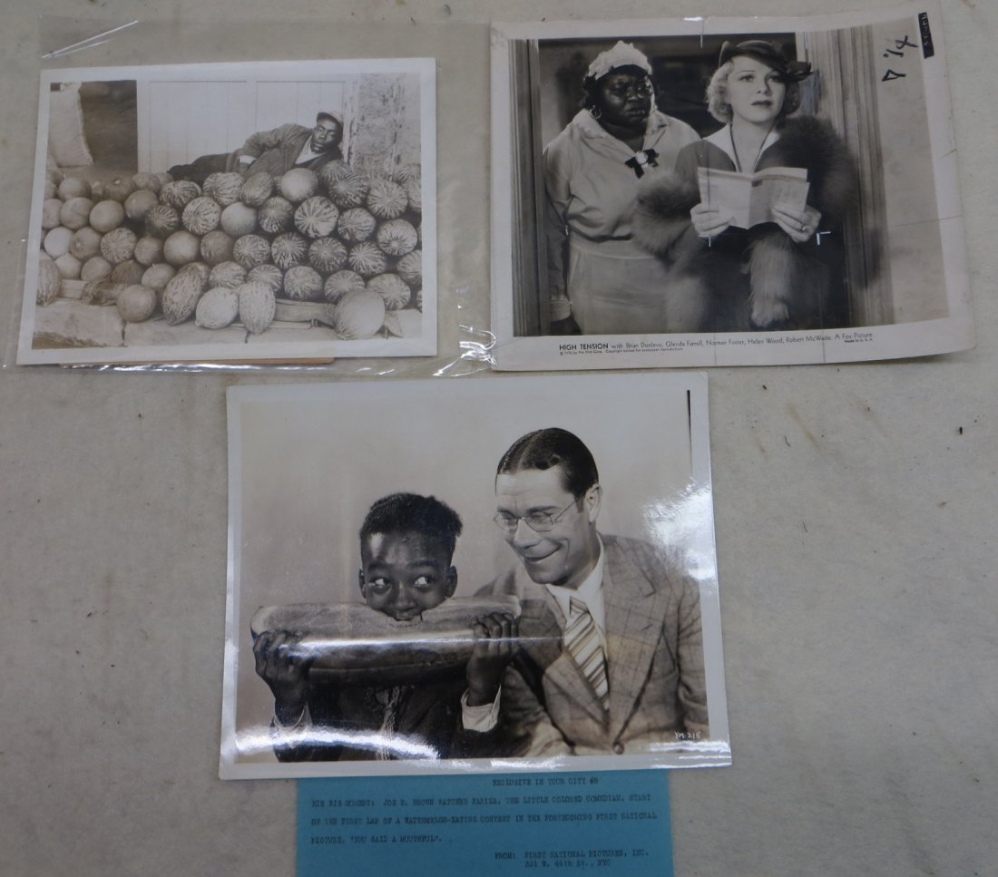 Three Black Americana history photos including 1: Three Black Americana history photos including 1 Associated Press NY photo showing man sleeping on watermelons in street in Smyrna - dated 1935, First National Pictures Inc. photo of Joe E. Brown watc