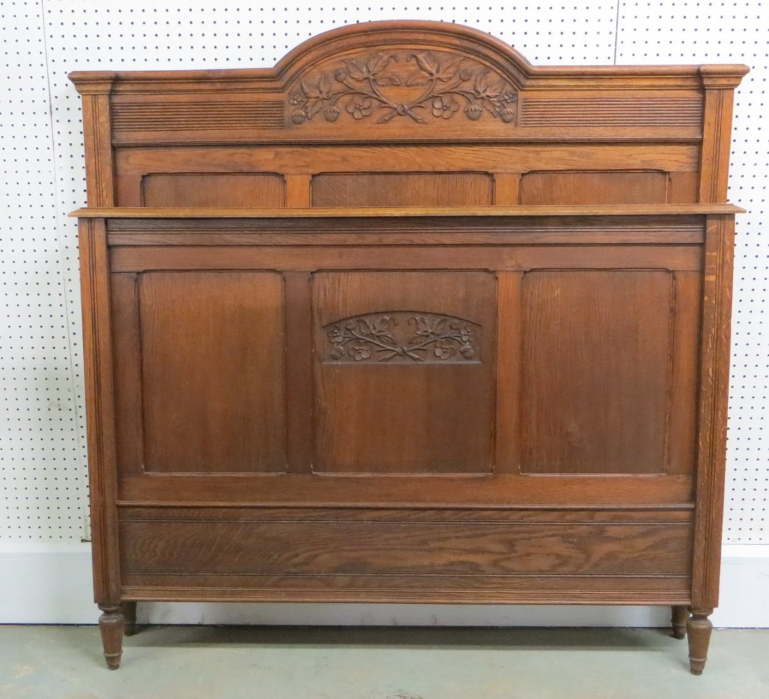 Art Nouveau style oak bed with carved flowers on head: Art Nouveau style oak bed with carved flowers on head board and footboard - full size - late 19th century. Excellent condition.