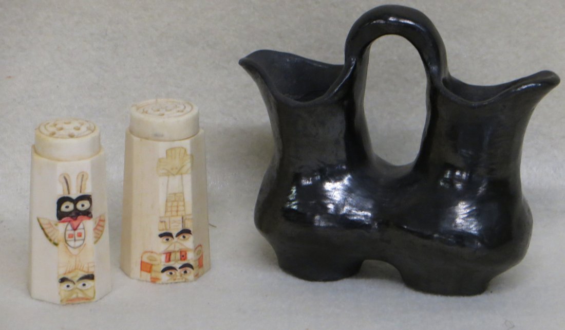 Two Native American artifacts including pair of bone: Two Native American artifacts including pair of bone salt and pepper shakers with scrimshaw of totem poles on front panel - probably early 20th century - 2.25"H together with a small blackware double 