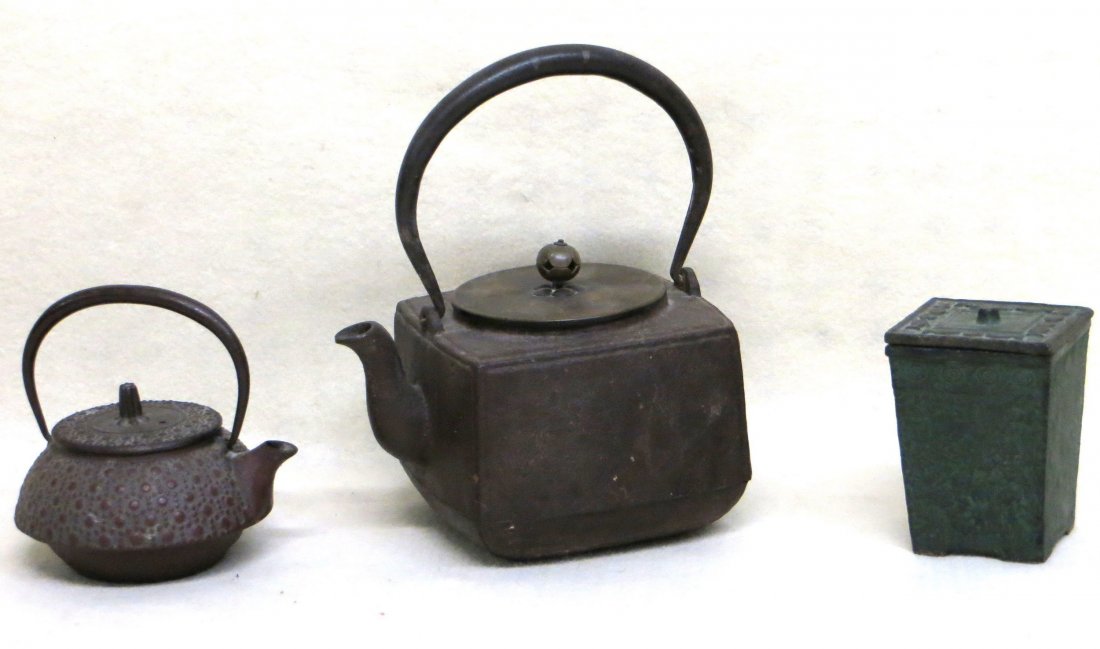 Three Japanese cast iron objects including 2 tea: Three Japanese cast iron objects including 2 tea kettles - 5" & 8.5"H to top of handles (one tea pot signed Japan and 1 unsigned), and a covered jar signed Japan - 4"H. All excellent condition, probab