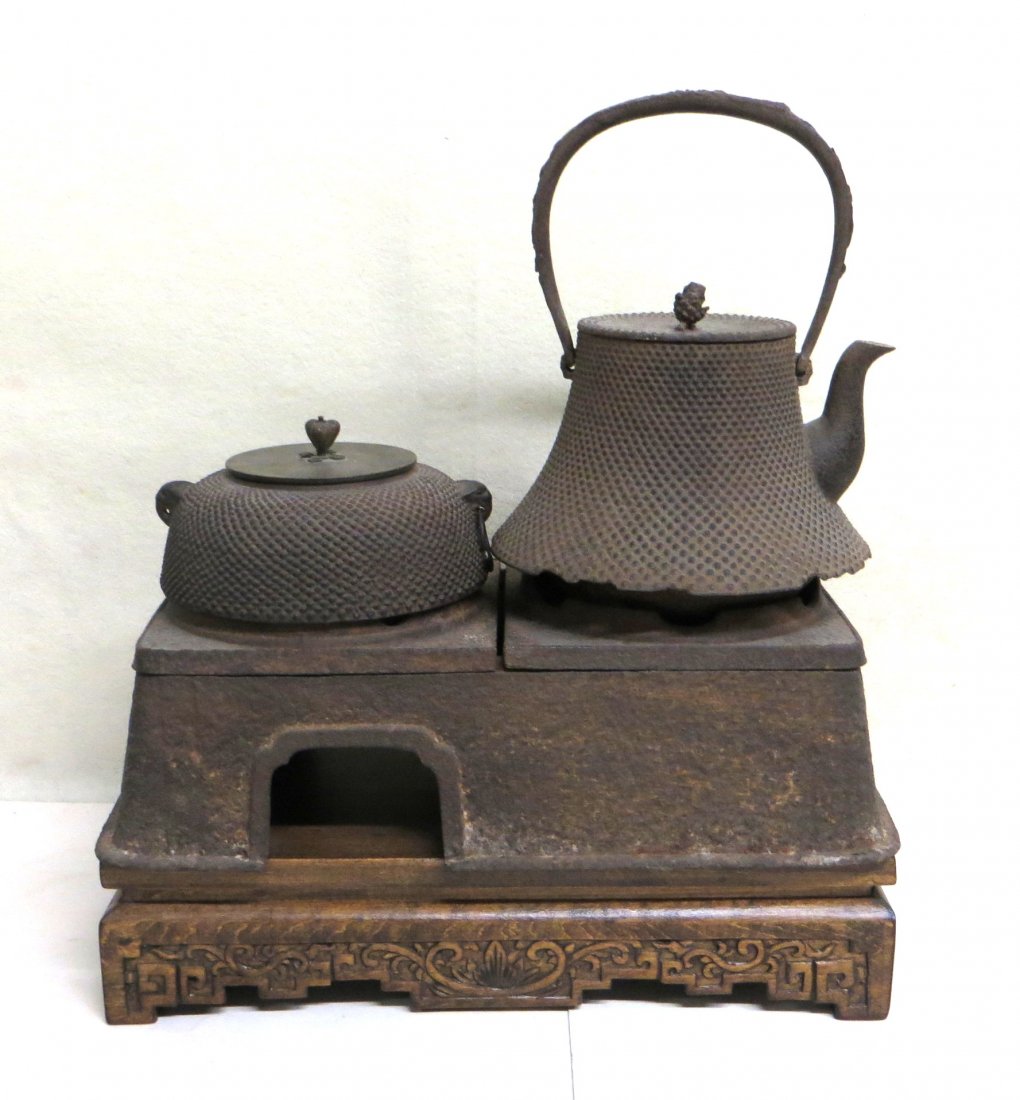 Japanese Hibachi set consisting of a non-matching: Japanese Hibachi set consisting of a non-matching wooden oriental base, cast iron stove holding 2 cast iron pot with bronze lid (oriental signature under lid), and a cast iron tea kettle signed on sid
